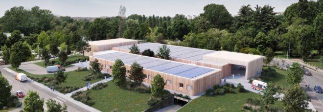 large hospital building topped with solar panels
