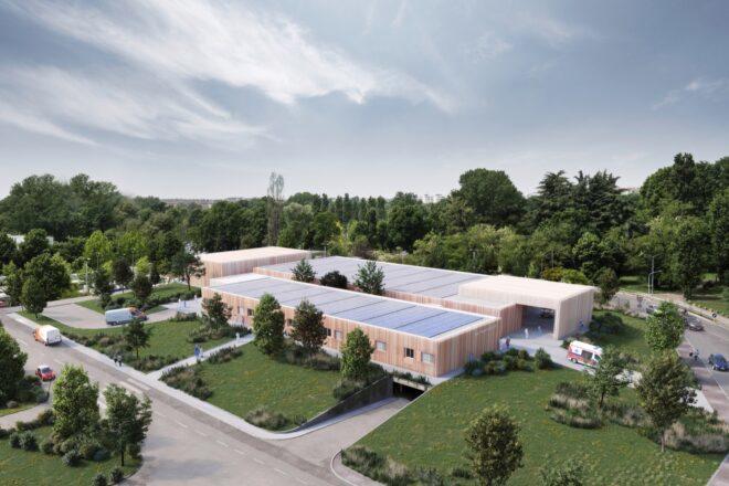 large hospital building topped with solar panels