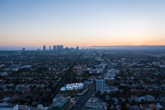 aerial view of white building surrounded by gray buildings in Los Angeles