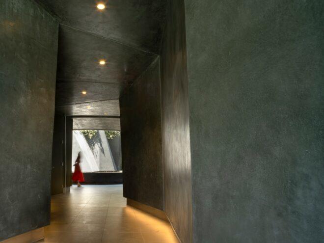 dark gray hallway with slanted ceiling