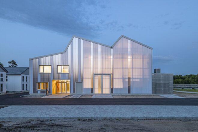 transparent building lit from within at night