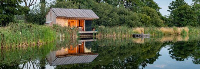 small wood cabin by a lake