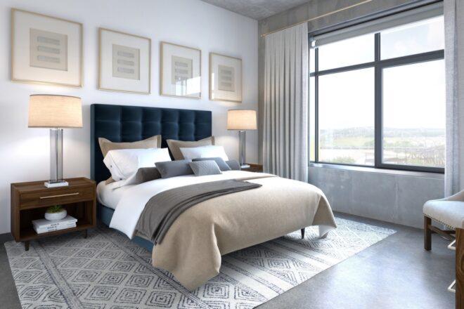 white bedroom with beige bed and large windows