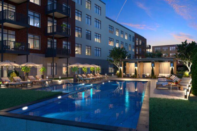 large apartment complex swimming pool at night