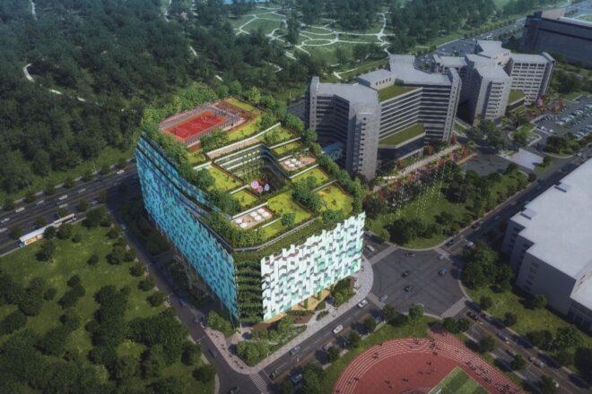 aerial rendering of glass hospital building with a green roof