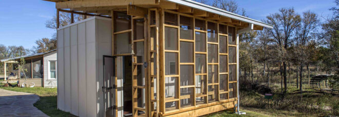 a small house with a wood frame comprised of various box frames