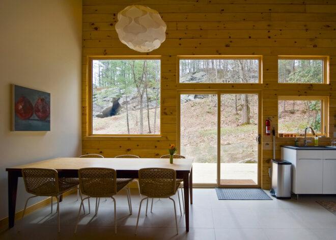 wood-lined room with wood dining table