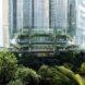 The base of the skyscraper, surrounded by greenery.