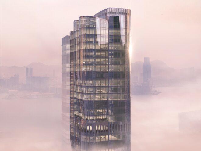 The top of the skyscraper, surrounded by fog.