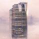 The top of the skyscraper, surrounded by fog.