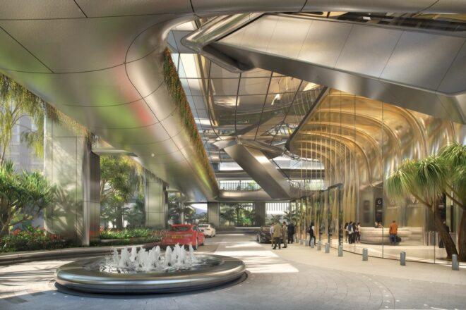 A covered courtyard/drive-in area with circular water fountain. The ceiling features curved metal structures.