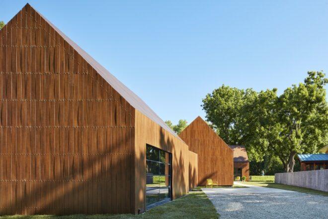 two gabled wood buildings