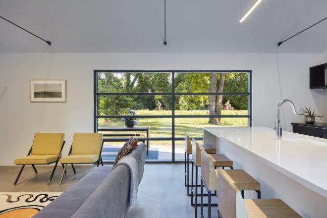 kitchen island facing back of gray sofa