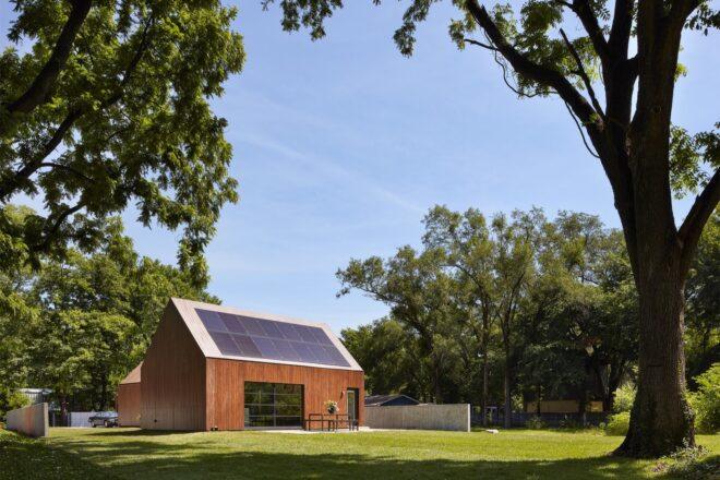 wood gabled building with solar panels