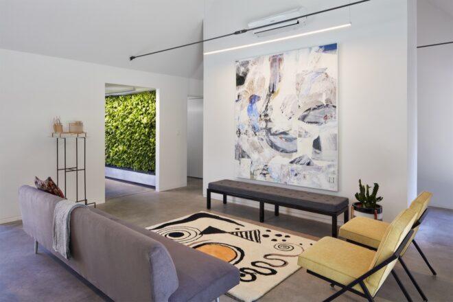 modern interior with gray sofa and patterned rug