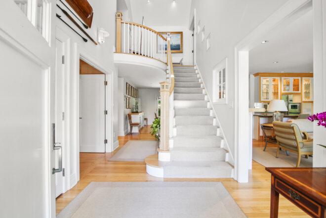entryway with large white staircase