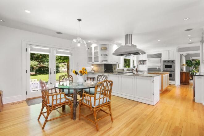 wood dining table near white kitchen island