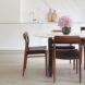 white dining table with dark wood chairs