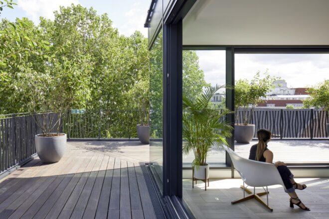 living room with sliding glass open to wooden deck