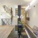 black reception desk near large staircase