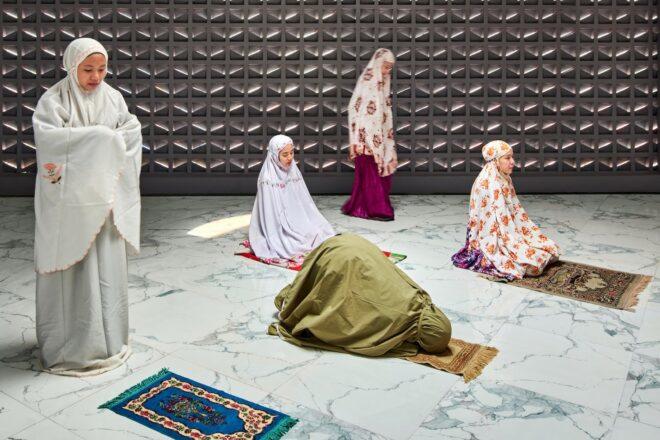 people praying inside a mosque