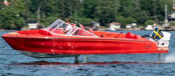 red electric speedboat with hydrofoils on water