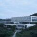 aluminum and white building surrounded by forest