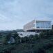 aluminum building elevated above white building