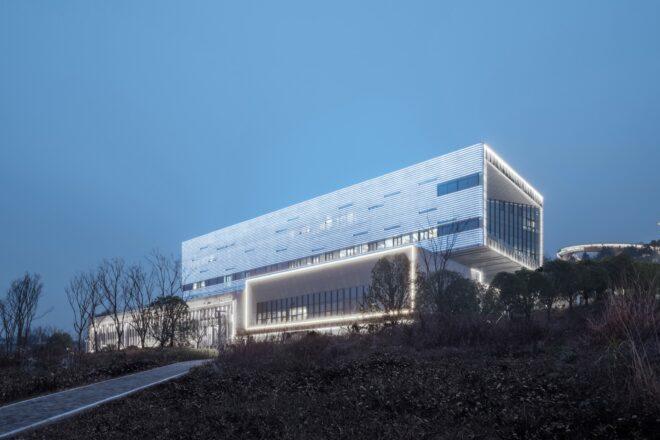 aluminum building lit up at dusk