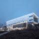 aluminum building lit up at dusk