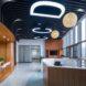 reception with wood desk and wood walls plus one wall of glass