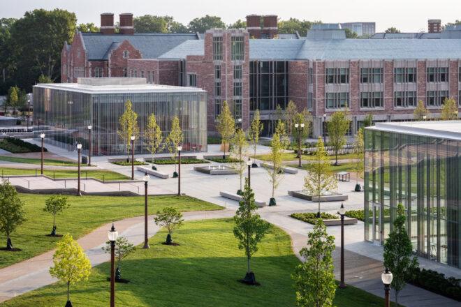 large brick university buildings and slightly smaller glass buildings
