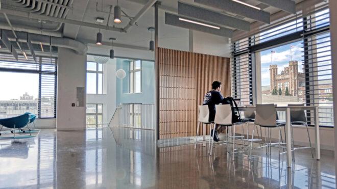 person working at desk near room divider