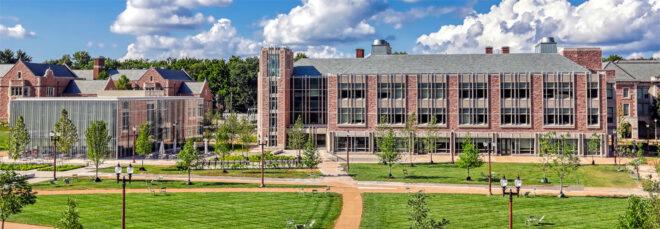 large brick university buildings and slightly smaller glass buildings