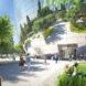 rendering of people walking toward bowl-shaped mirrored building