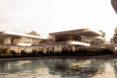 rendering of pool beside home with staggered terraces