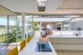 yellow stools against a white kitchen peninsula