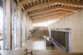 wall of cubbies inside timber building with glass walls
