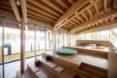 stepped timber seating inside timber-framed building