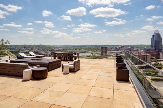 lounge chairs and firepit on rooftop deck