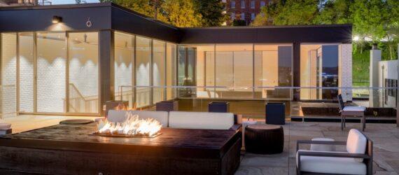 fire pit near glass home
