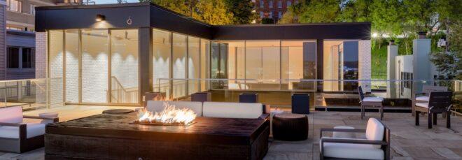 fire pit near glass home