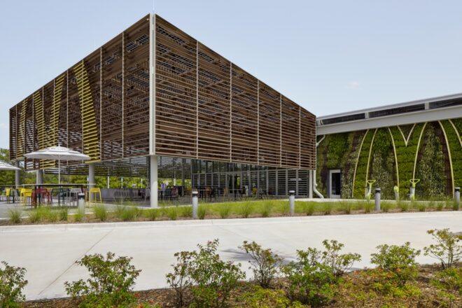 the back corner of the building, featured a facade of wood slats decorated with a yellow "M."