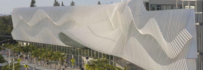 convention center building with large metal exterior with a wavy pattern