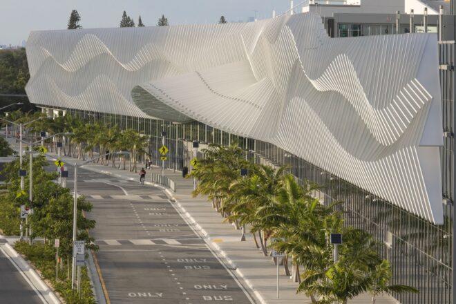 convention center building with large metal exterior with a wavy pattern