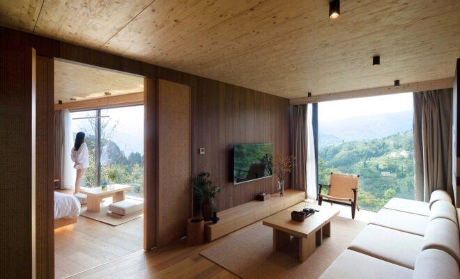 wood-lined interior with wood furnishings and floor-to-ceiling windows