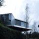 mirrored cabin perched on a hill