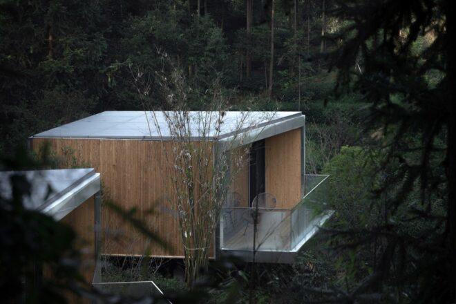 rectangular wood cabin with large deck