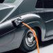 electric charger plugged into gray Rolls-Royce