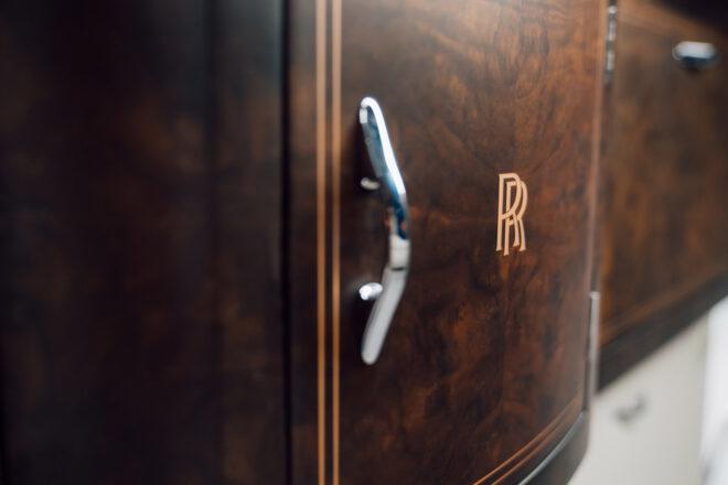 Rolls-Royce emblem stamped into dark cabinet